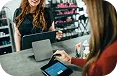 Entrepreneur researching how to choose the right business loan on a laptop